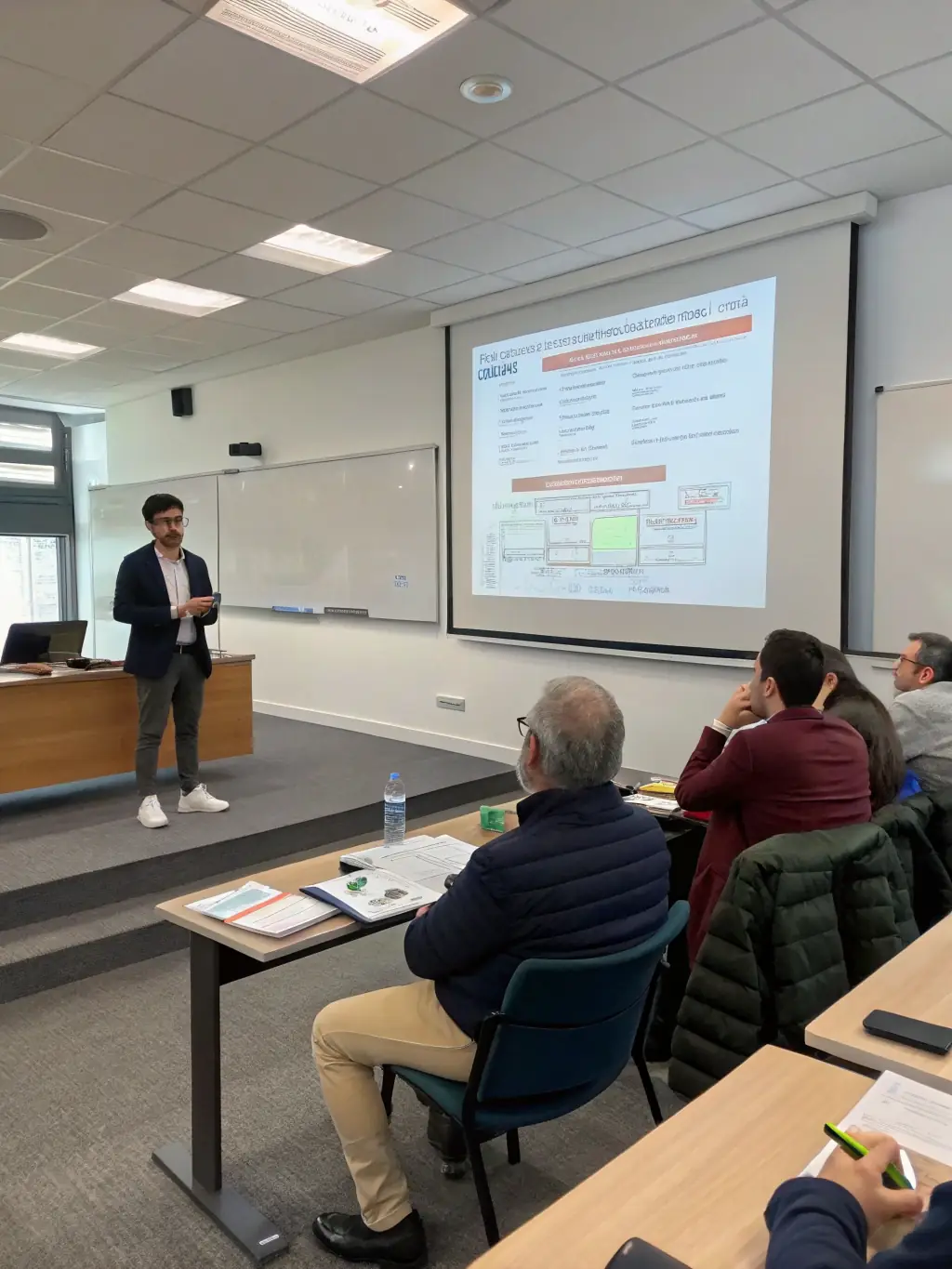 A student showcasing their completed game project to a panel of industry professionals, demonstrating the practical application of learned skills and industry relevance.